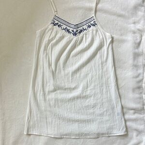 casual white dress with blue embroidery detail